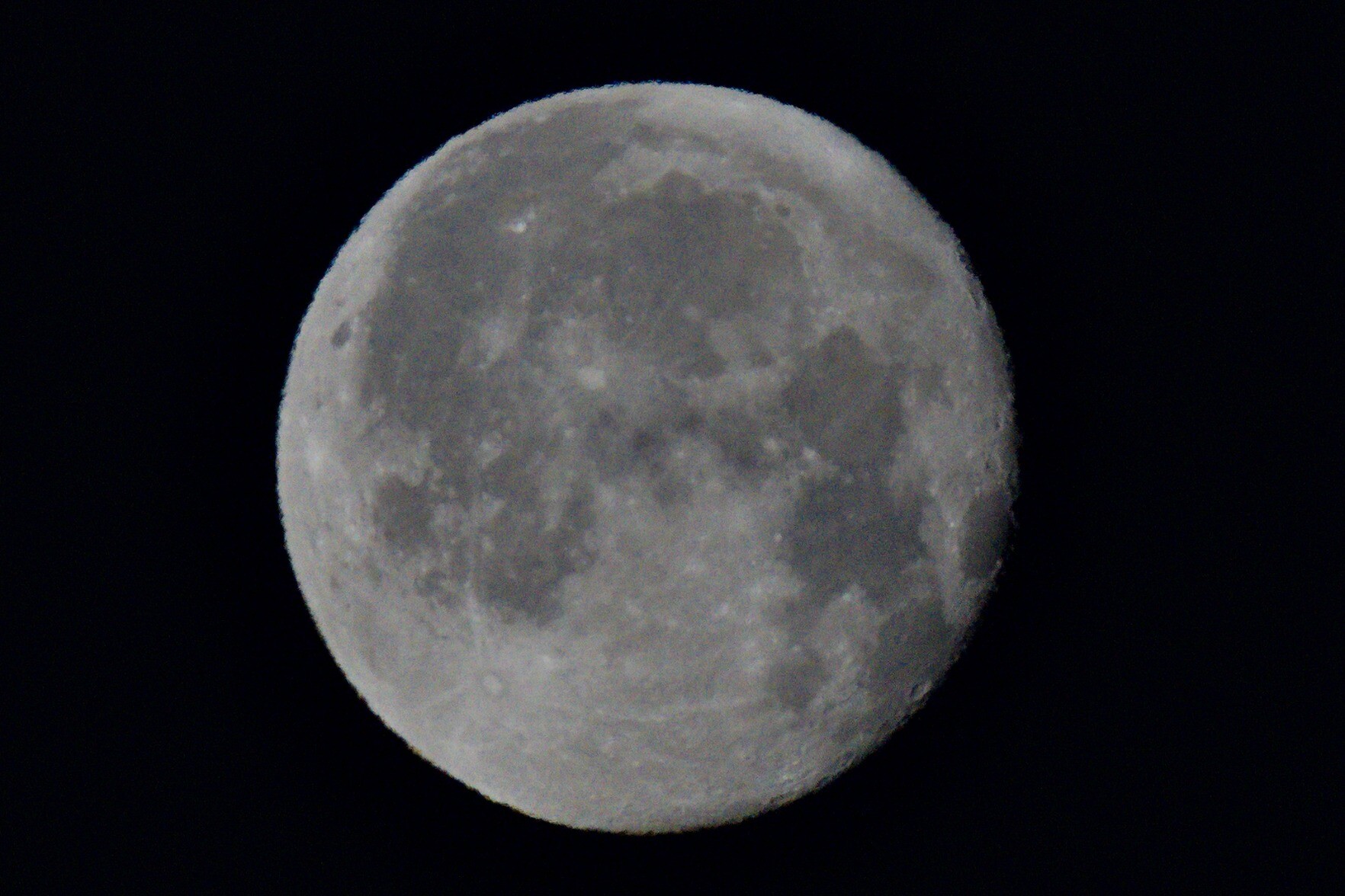The image is a close up of the moon taken from southern Spain. There are the major craters and features to be seen.