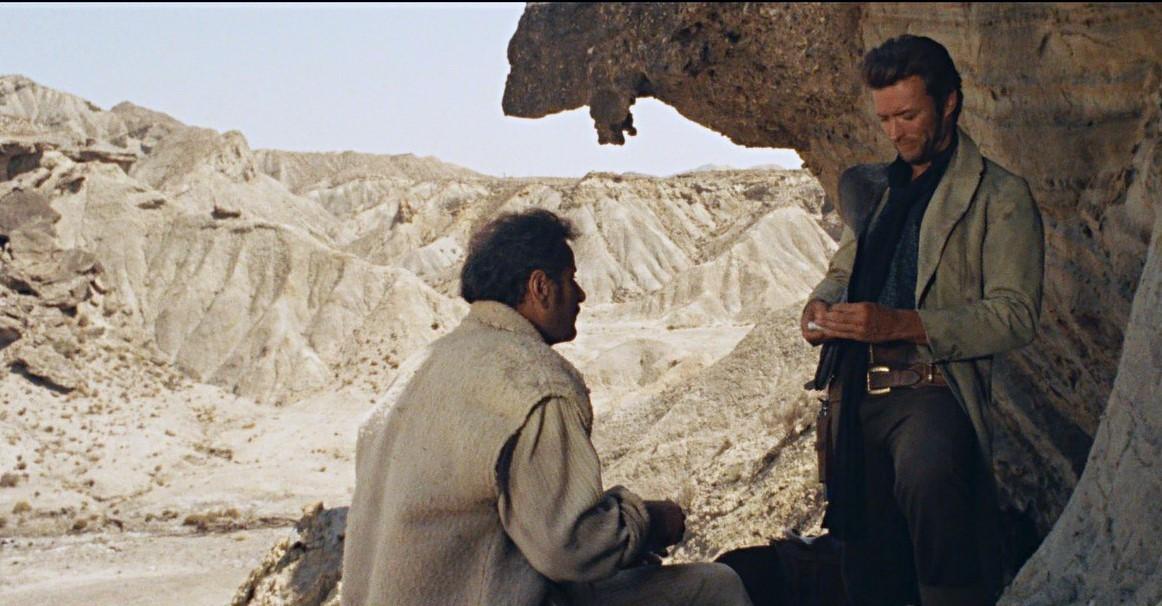 Eli Wallach and Clint Eastwood split the loot beneath a spectacular rock overhang in the Good, the Bad & the Ugly