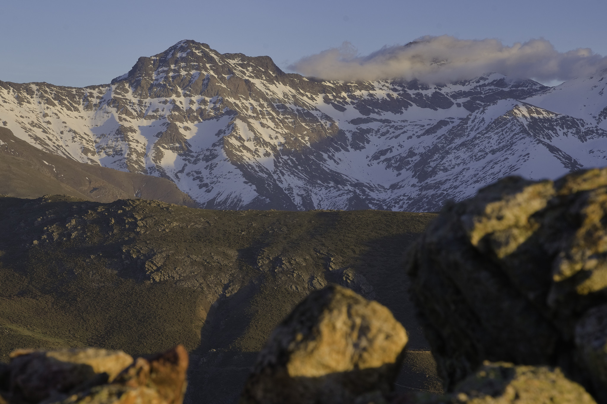 Alcazaba 3371m with cloud gathering around Mulhacen 3482m