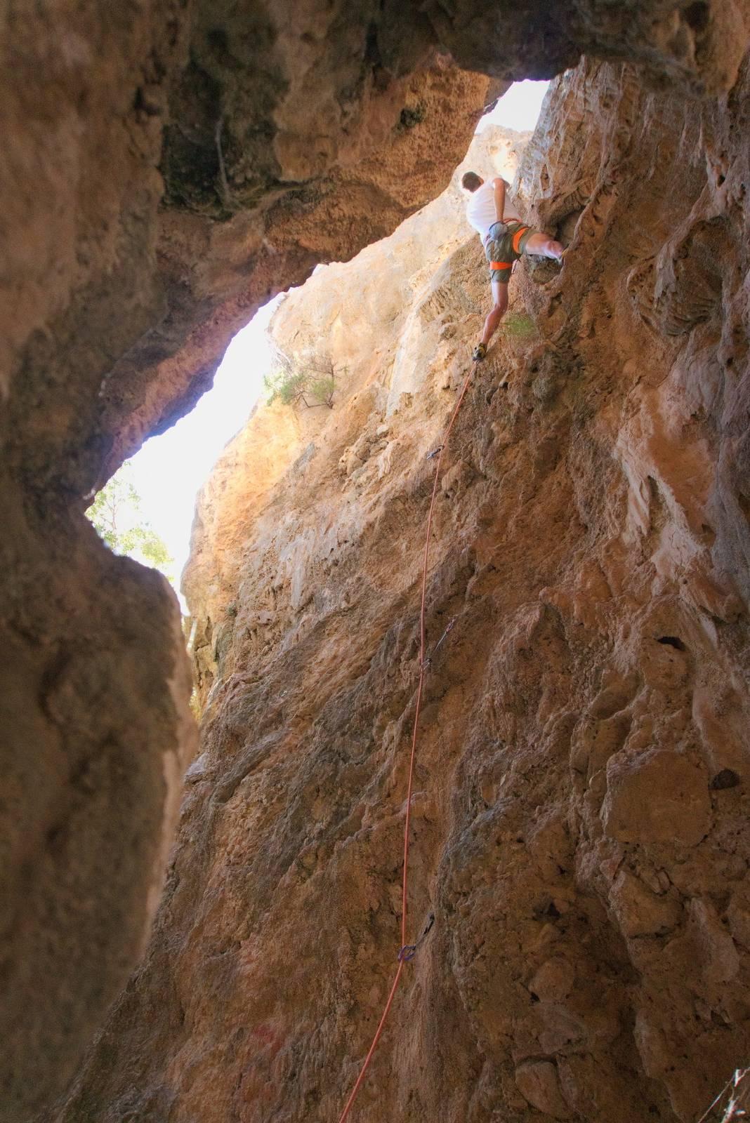 Rock climbing out of a spectacular gorge near Lanjaron in Spain. A rock climber is in the upper right