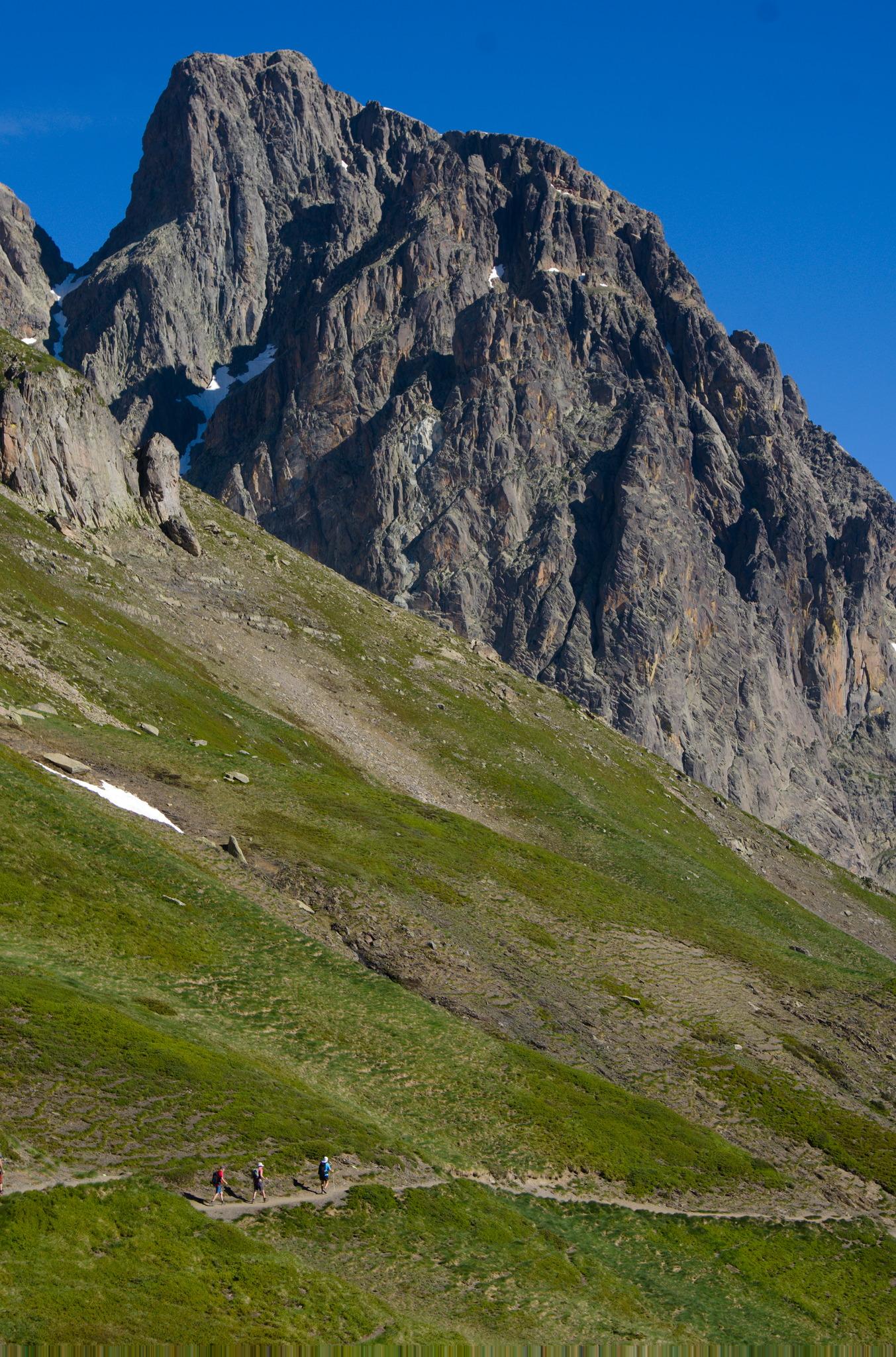 Hikers on a path below Pic du Midi d'Ossau 2884m