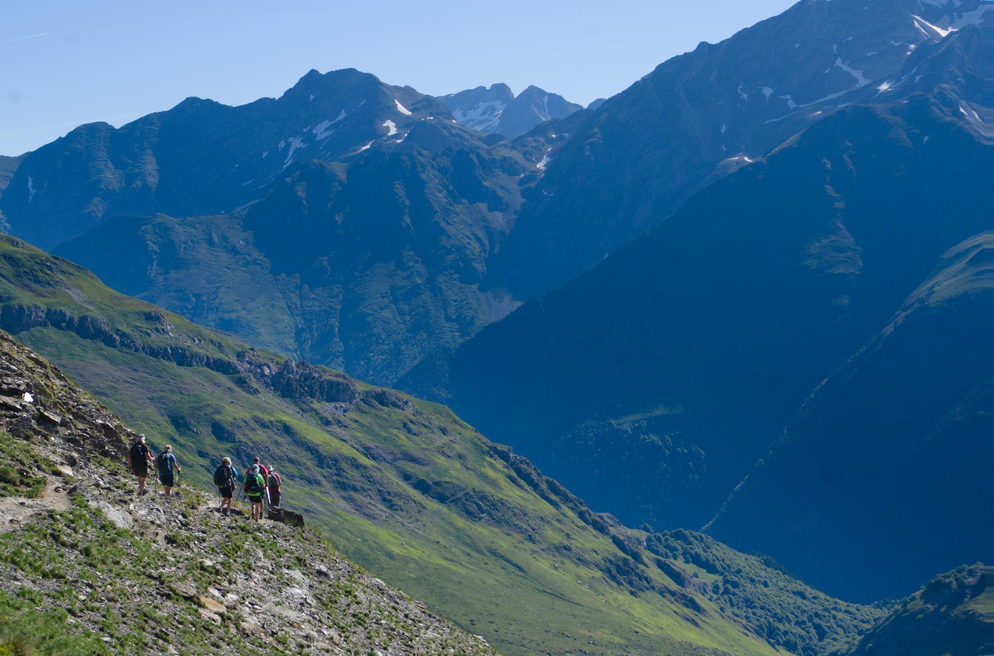 On the trail to the Refuge du Pombie. A deep valley to the right with the Pyrenees behind