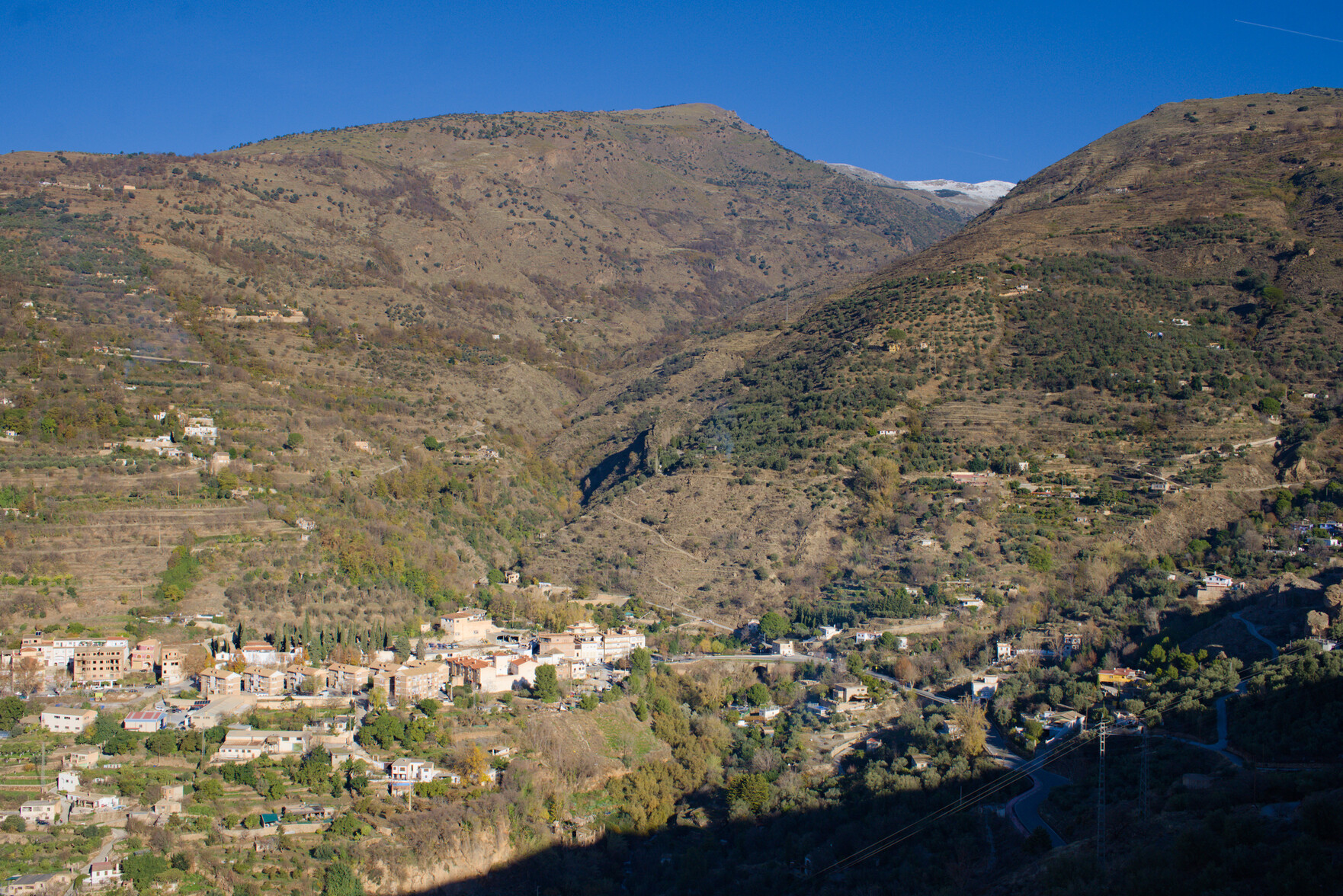 The Rio Lanjaron valley leading up to the initial snows of the Cerro de Caballo, 3009m