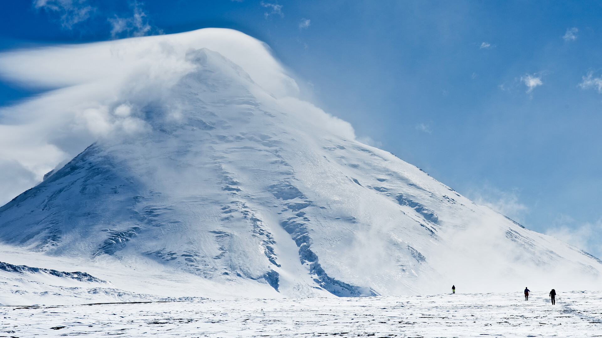 Massive lenticular clouds forming over the peak of Kamen on the Kamchatka peninsular