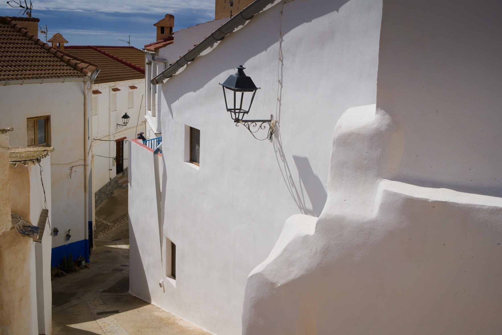 Street scene in Polopos, Spain. Whitewashed houses and narrow streets