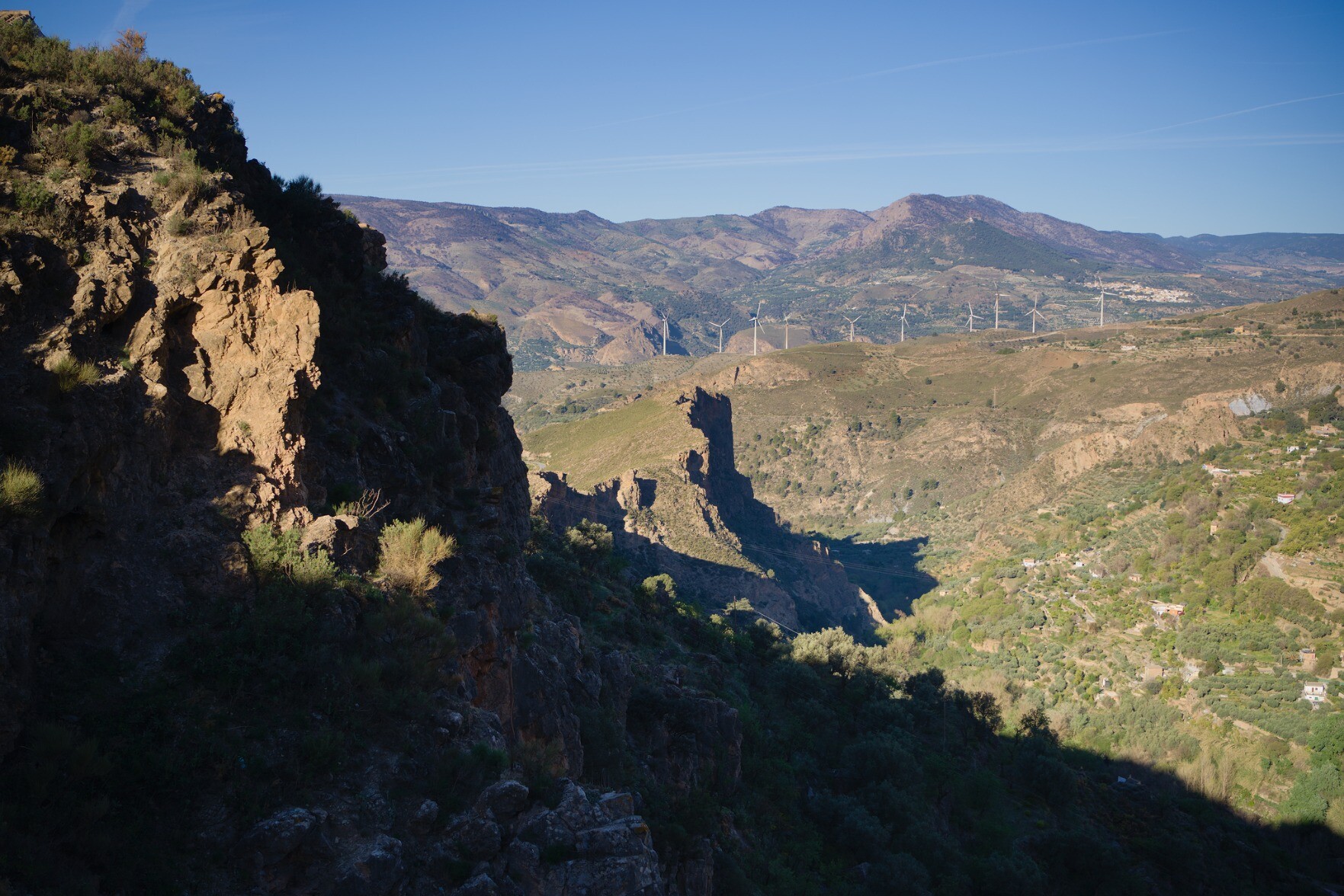 The first rays of the sun  light up some cliffs in Andalucia, Spain. Some dark shadows to the left but clear views to the right