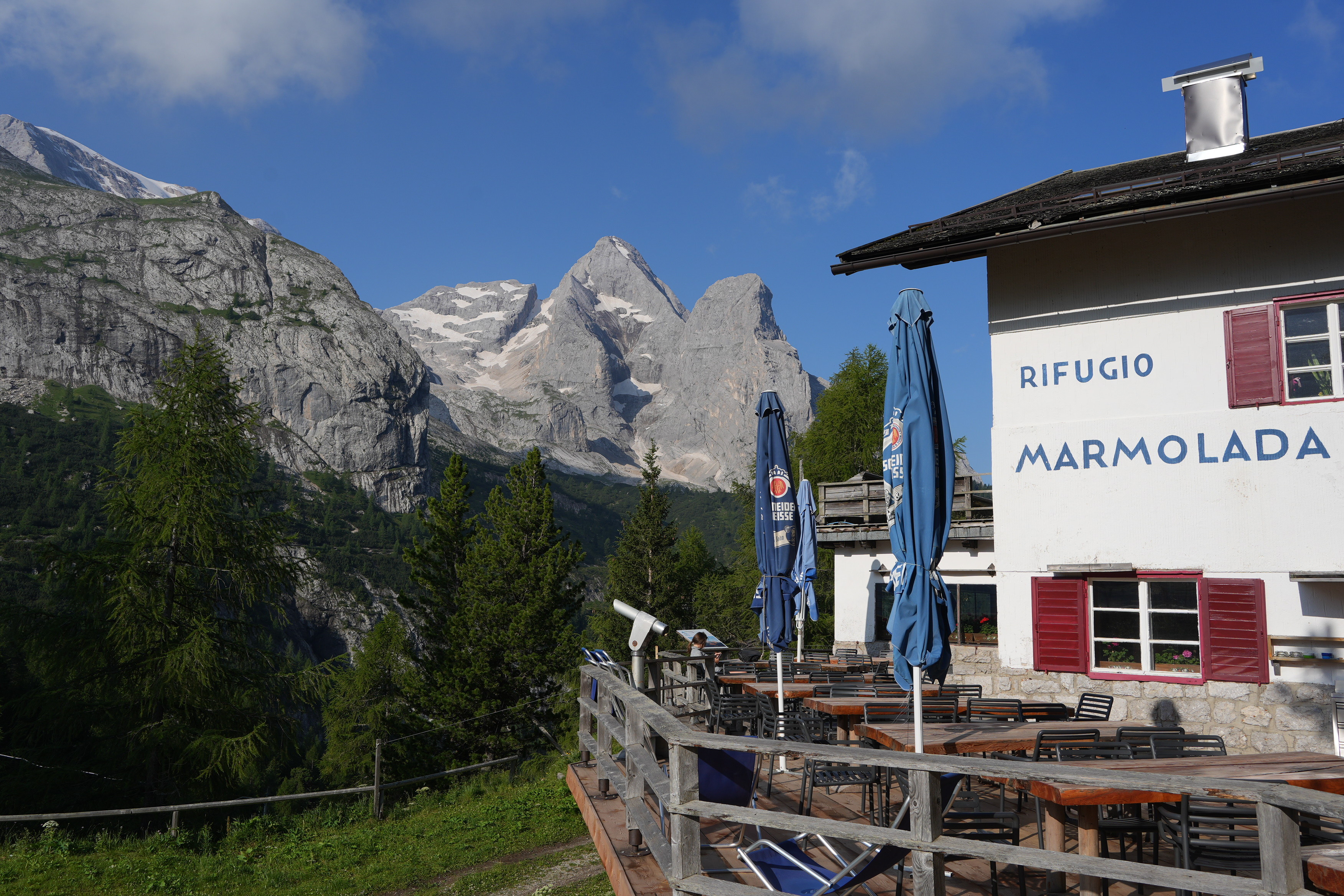 An alpine refuge sits at the base of the Marmolada mountain