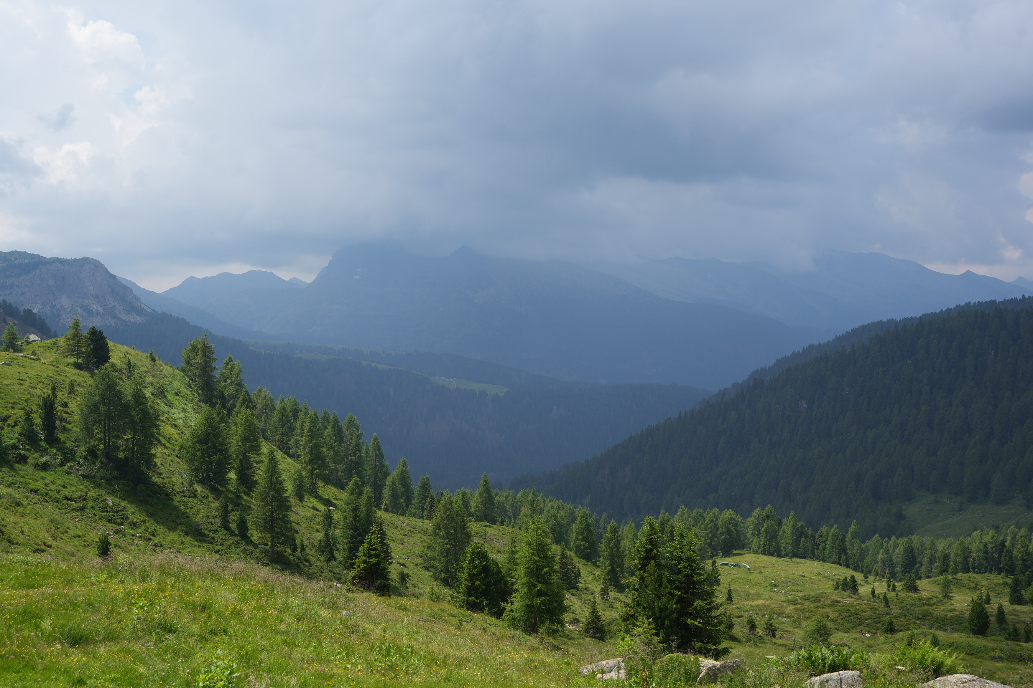Green meadows with and approaching storm behind