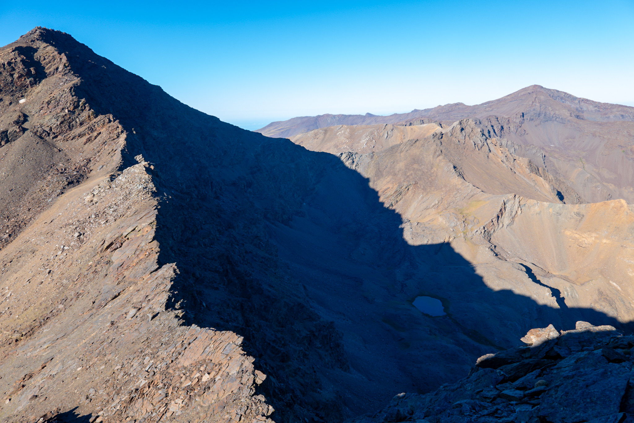 The north ridge of Mulhacen in morning sunlight. In the distance the summit of Veleta