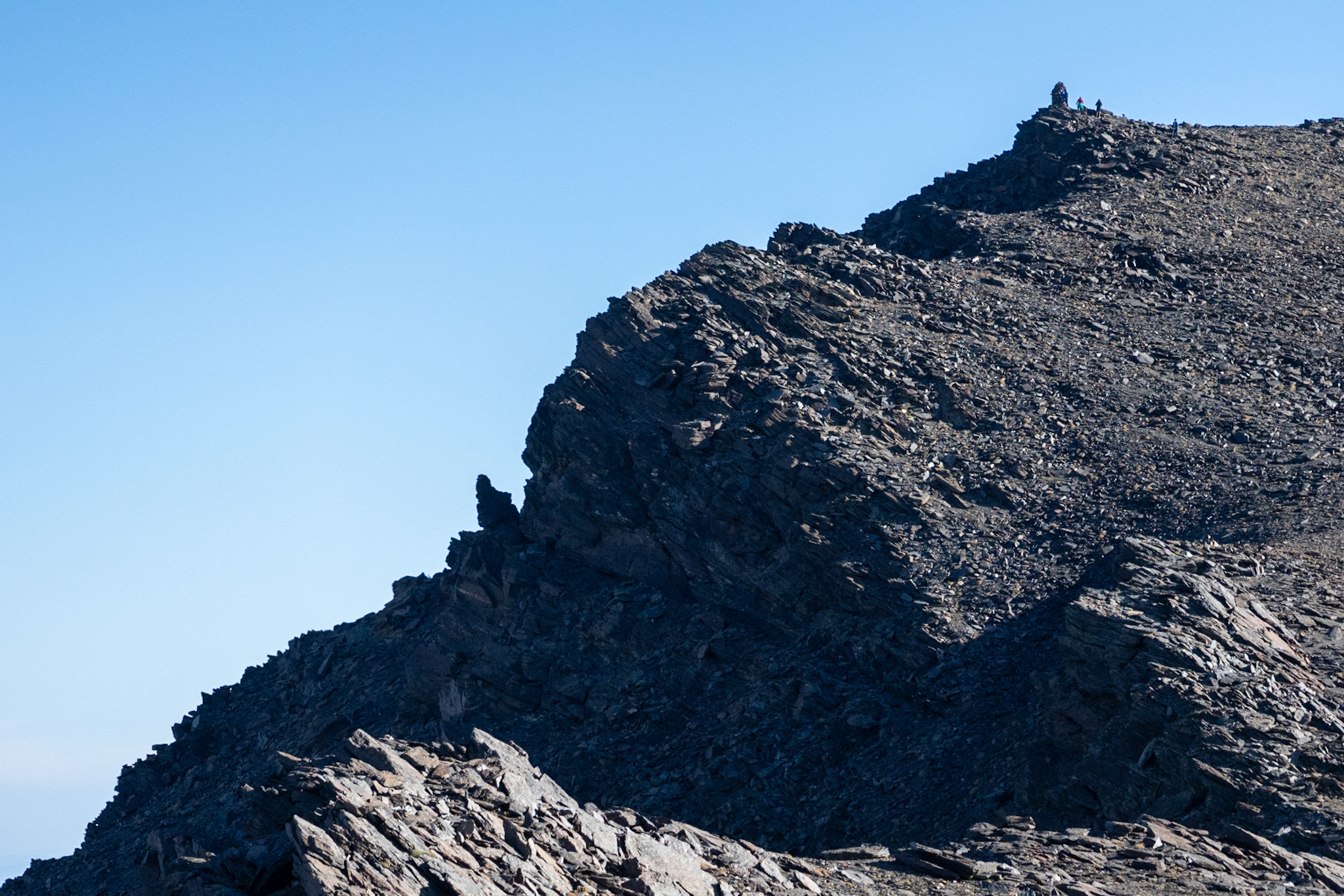 Some of our group on the summit of Alcazaba with the vertical north west face to the left.