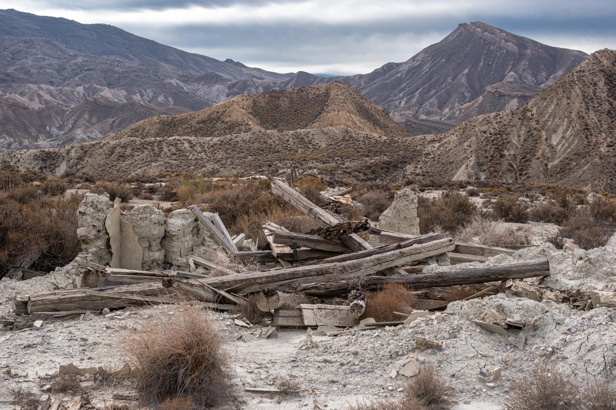 Some remains of an old film set with a mountain in the back right
