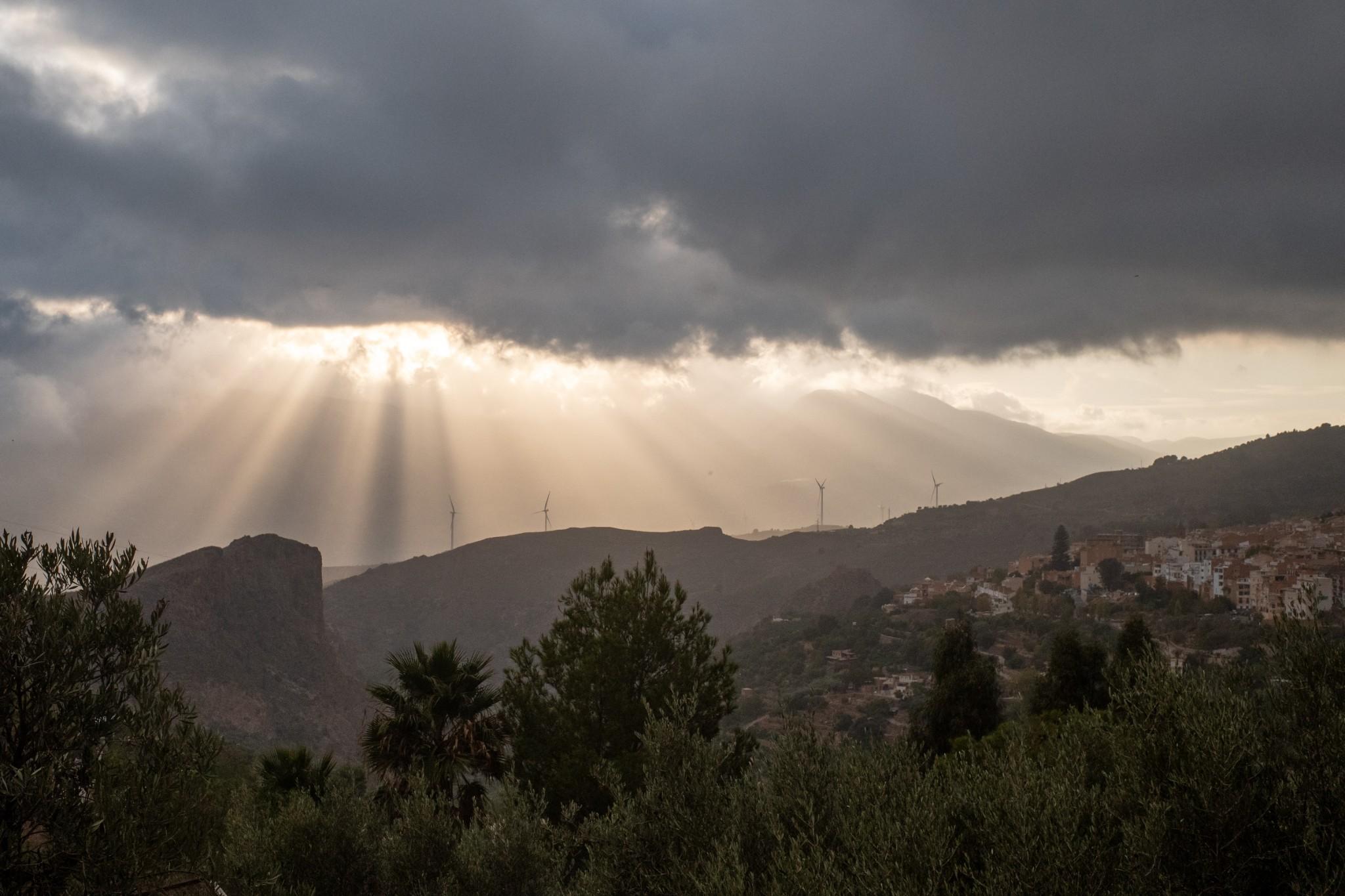 Beautiful light coming through the clouds above Lanjarón this evening