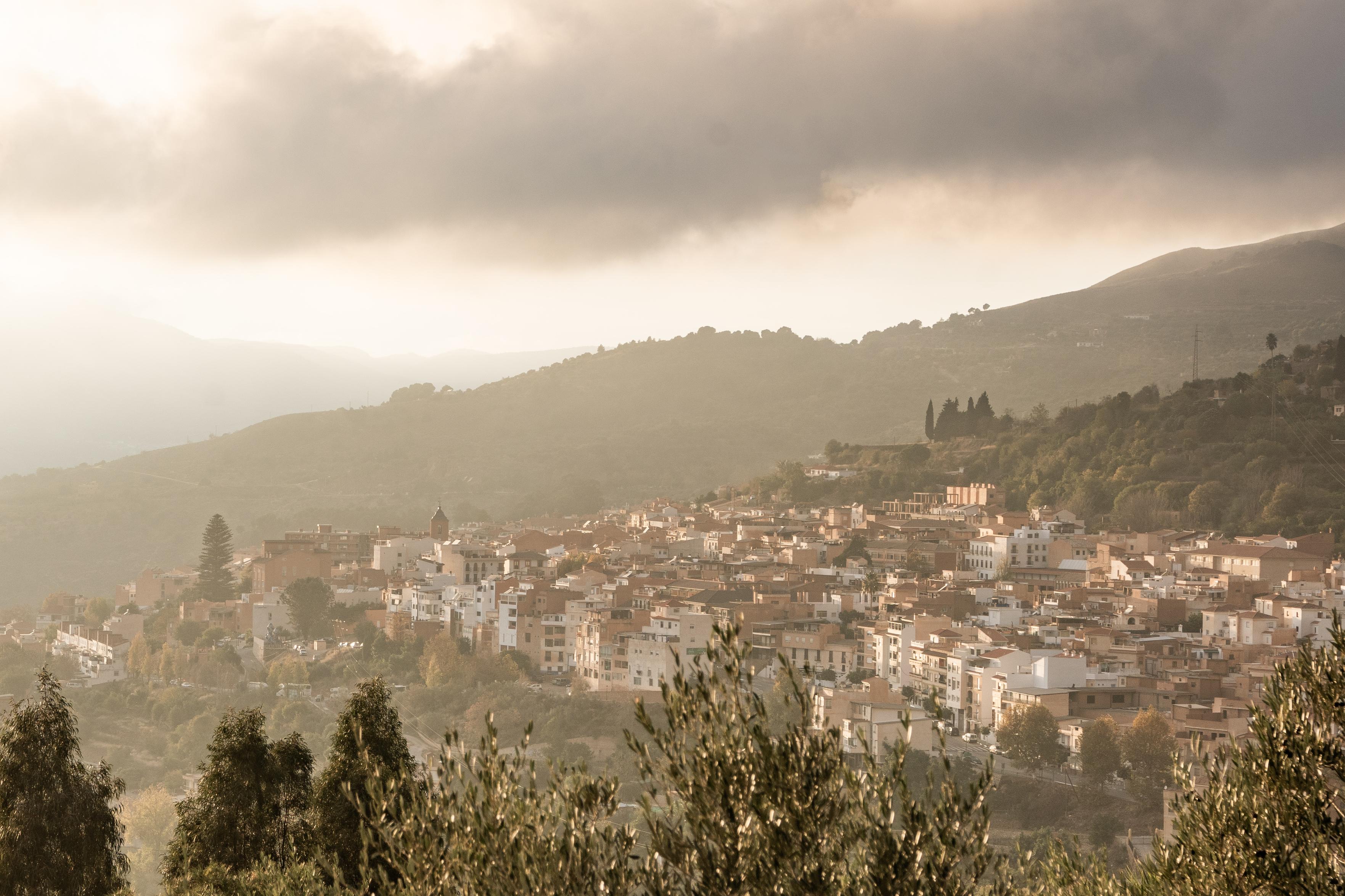 Beautiful late afternoon hazy sunshine highlighting the rooftops of Lanjarón in Granada province.