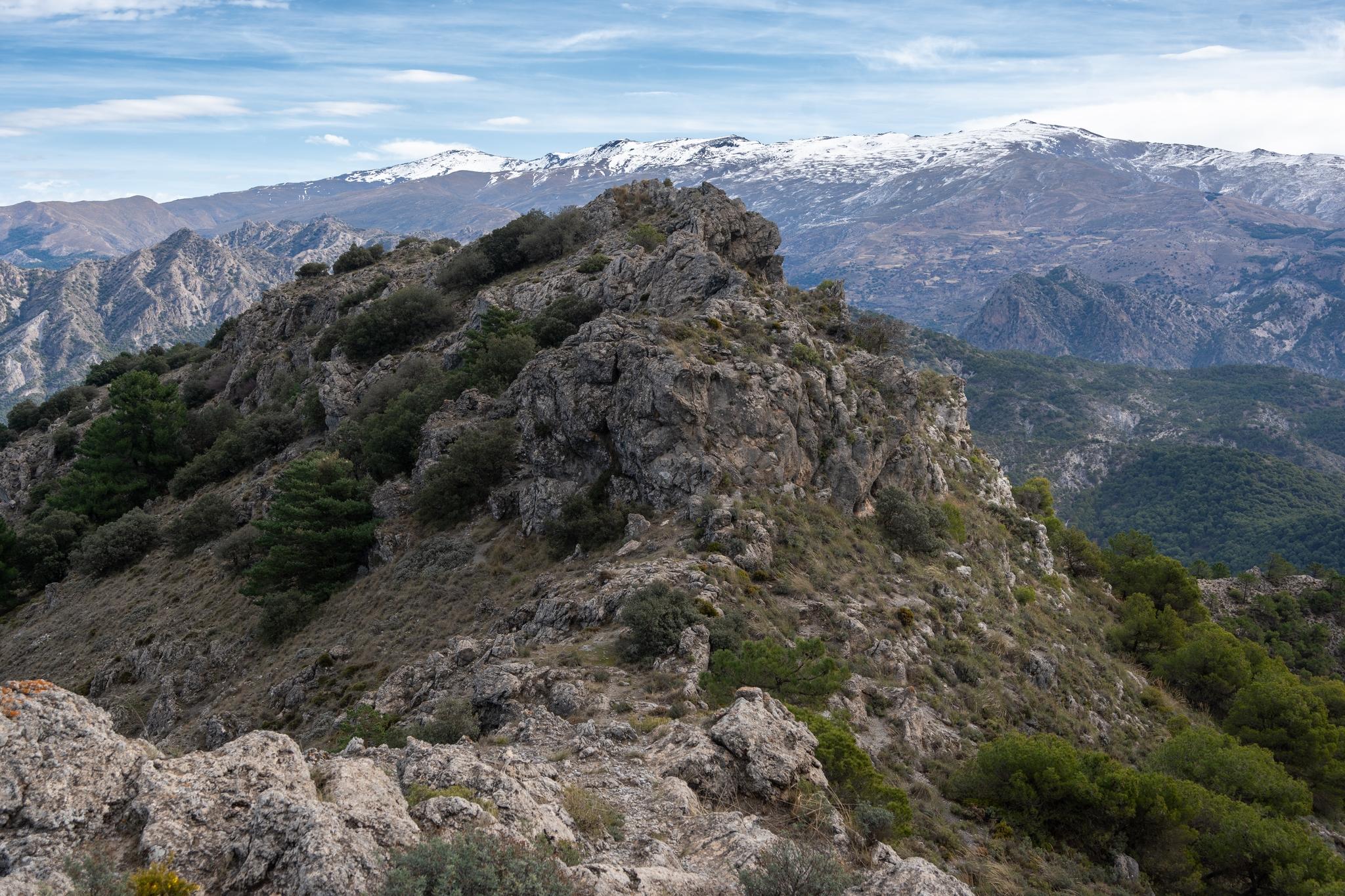 From the summit of Silleta de Padul looking towards the ridge line leading to the snow covered mountains of the Sierra Nevada