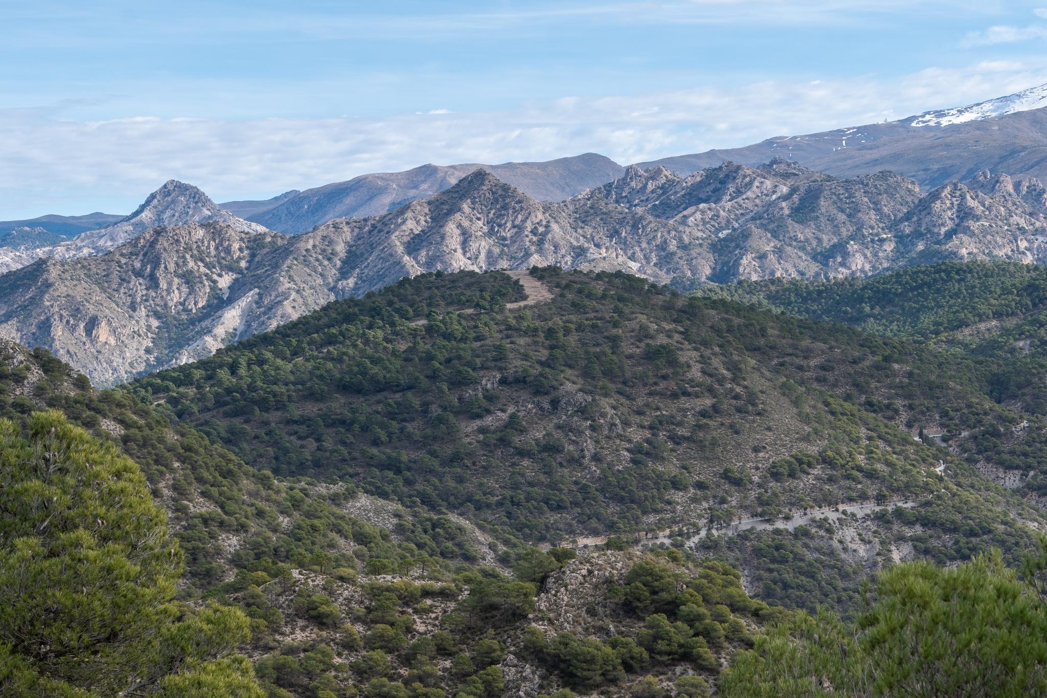 The mountains of the Cumbres Verdes near Granada. You can see Trevenque on the left and the Alayos de Dilar range closer. Top right is the start of the snow covered Sierra Nevada 