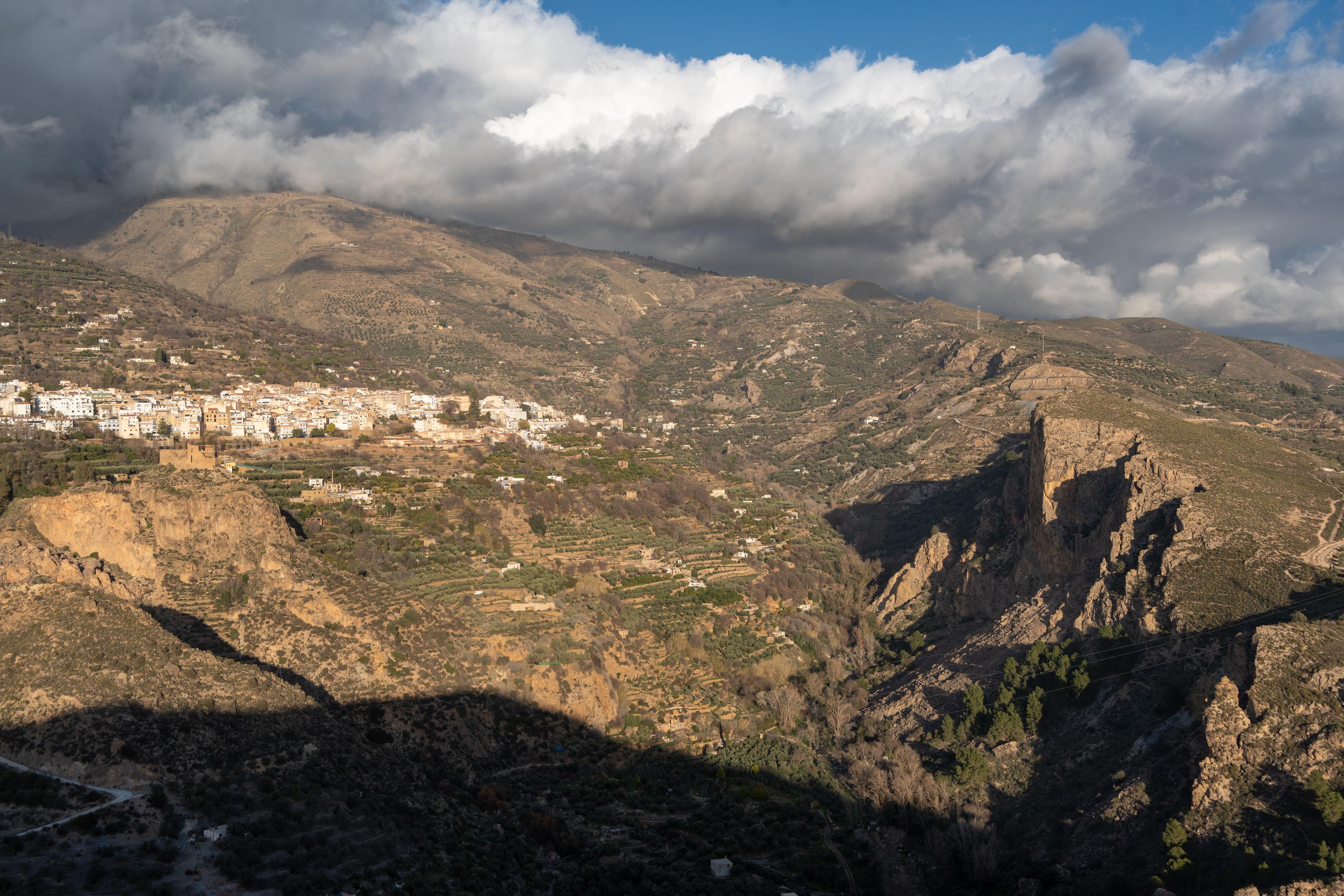 Evening light over Lanjaron and the cliffs of Tajos Colorao tonight. Clouds building over the Sierra Nevada behind