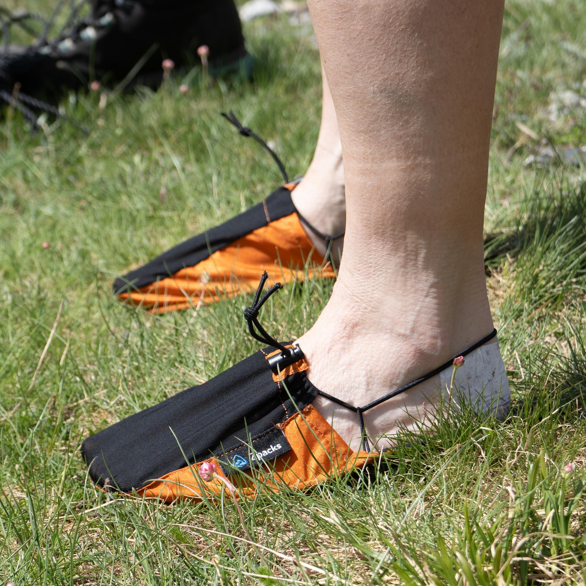 A pair of orange Zpacks Ultralightweight Camp Shoes