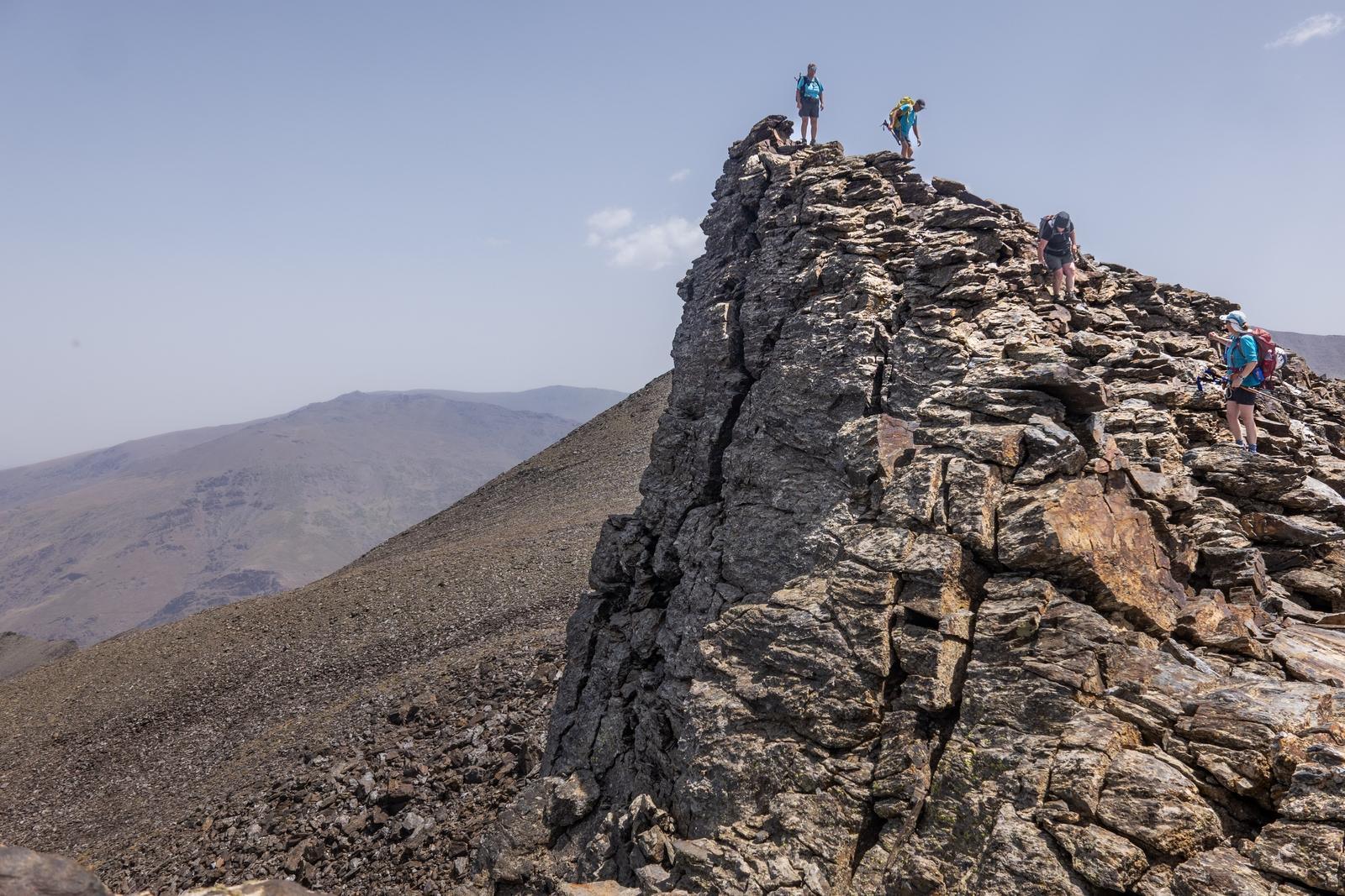 4 scramblers descending the peak of Zacatin in Spain's Sierra Nevada