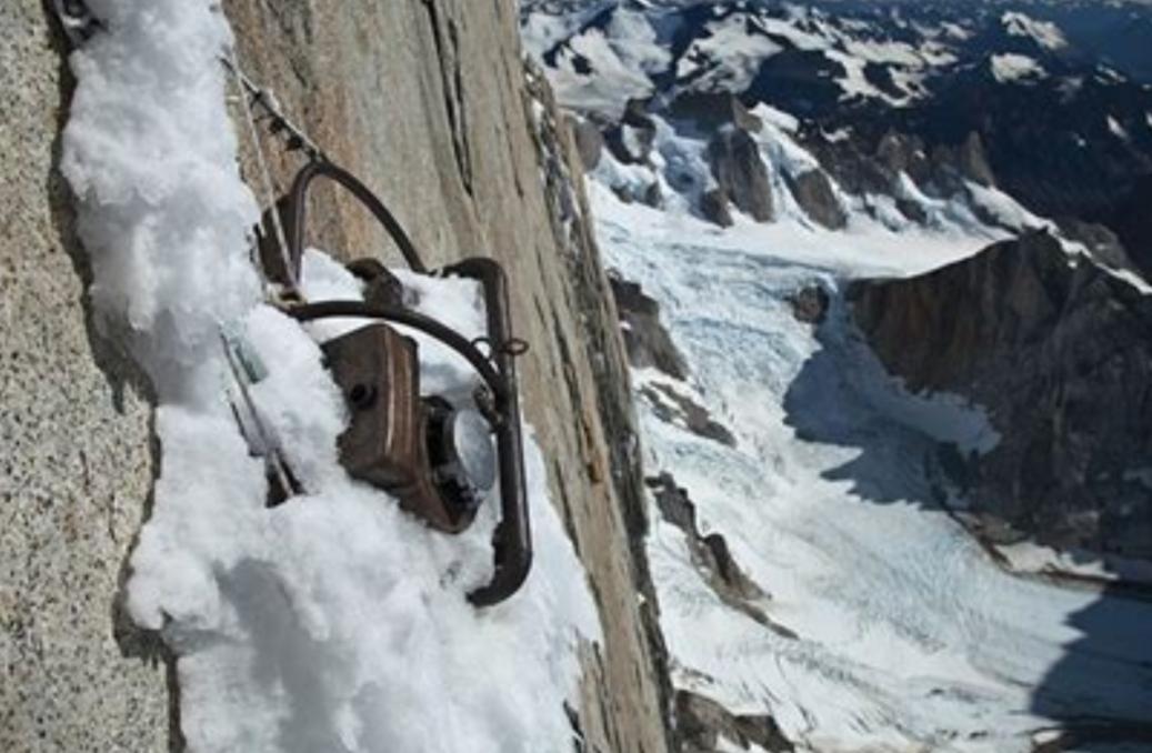 A bolted compressor on a mountain wall in snow