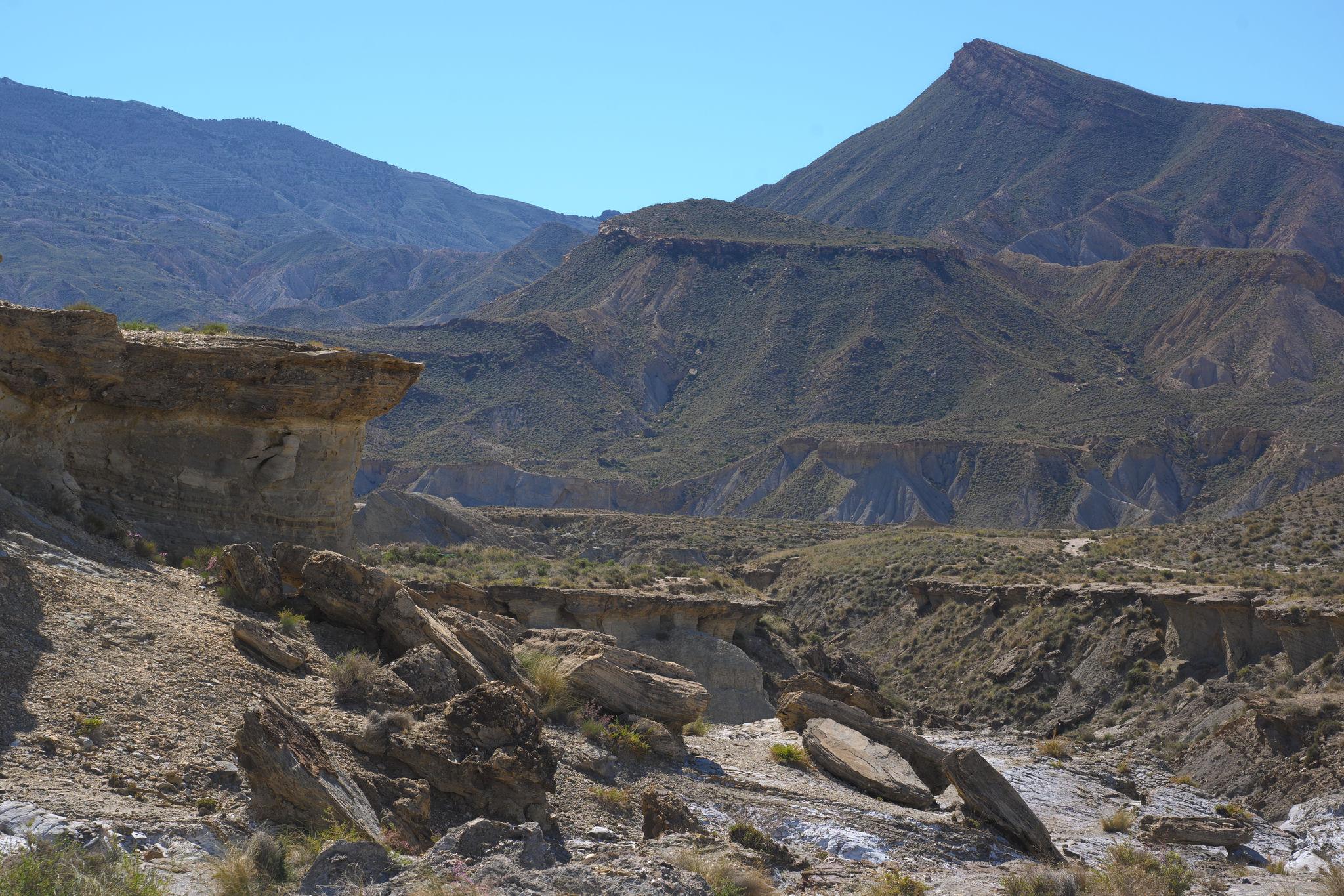 Cerro Alfaro peak is on the far right of the image. Closer, to the left in the foreground is a broken overhanging rock wall which was used for the tank scene in the movie "Raiders of the Lost Ark"