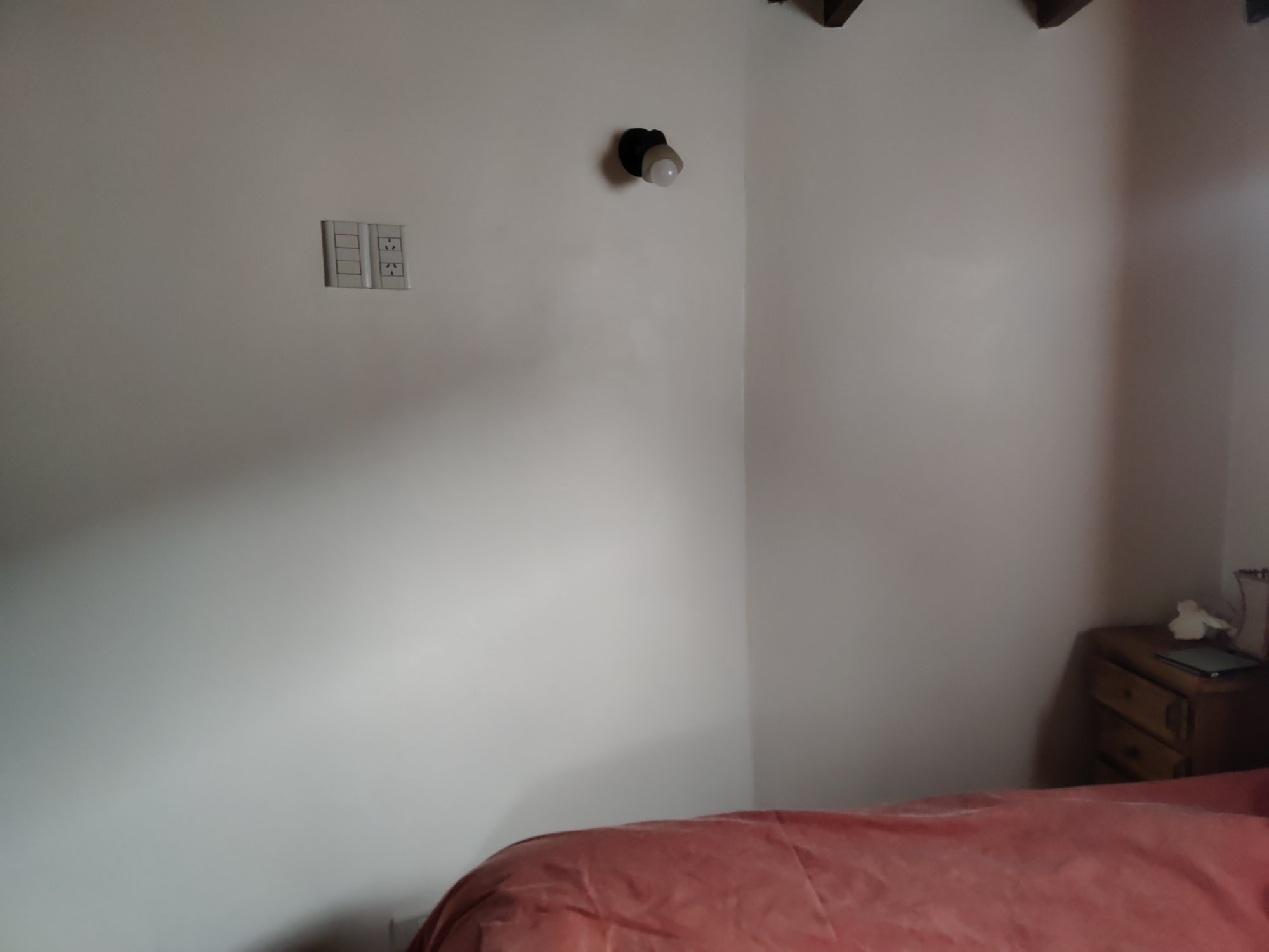 Electric sockets halfway up a wall